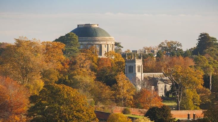 Trees in full autumn colour at Ickworth Estate surrounding the Rotunda and Church
